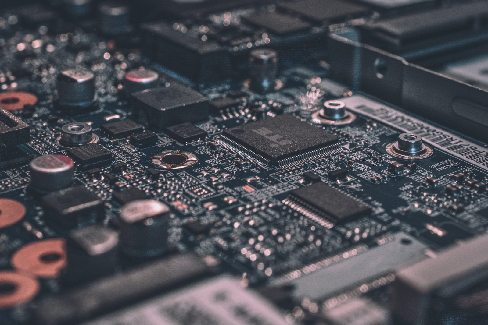 Illustrative close-up of a circuit board representing AI agent software infrastructure