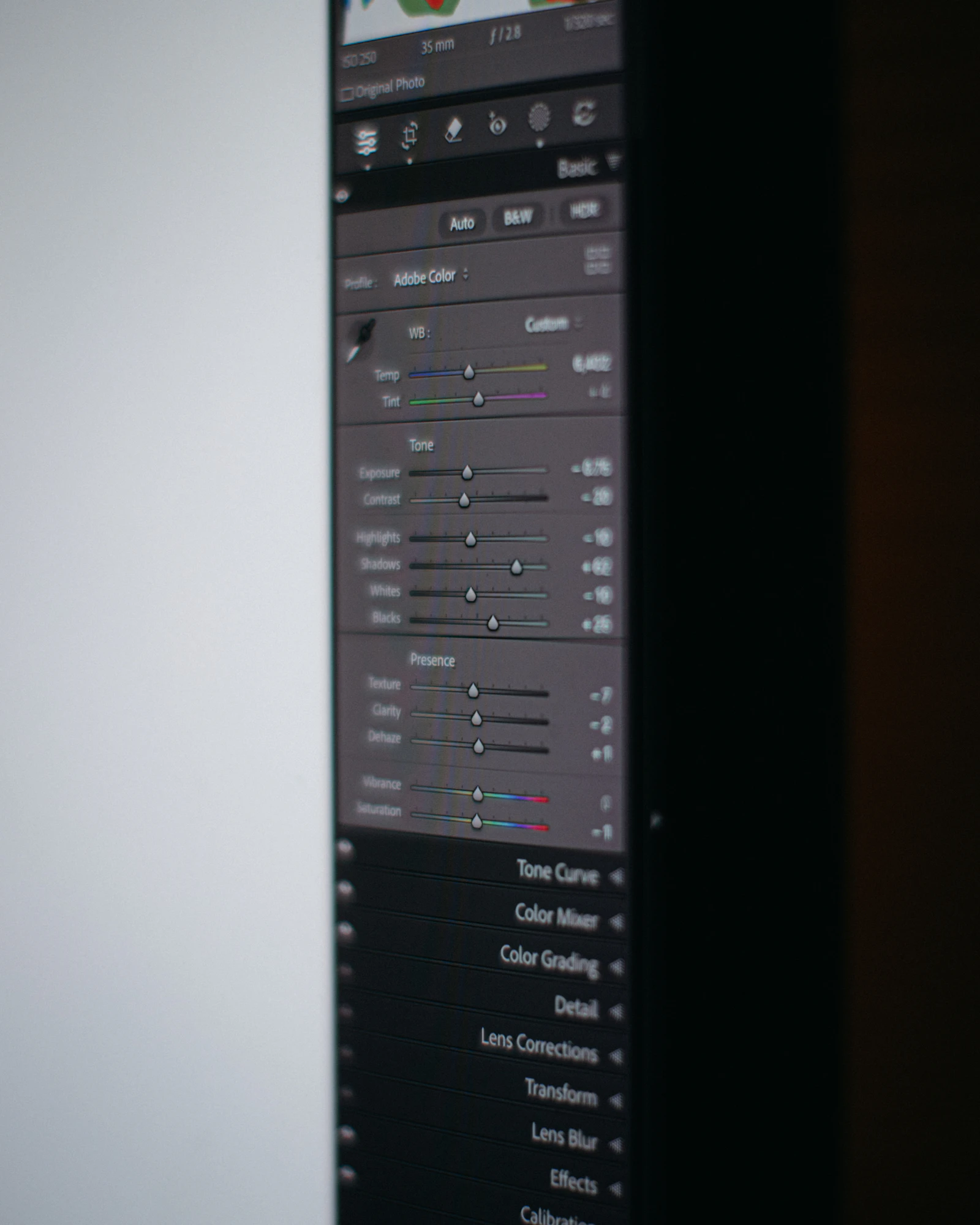 A computer monitor showing a photo-editing interface, illustrating AI-assisted image generation and editing.